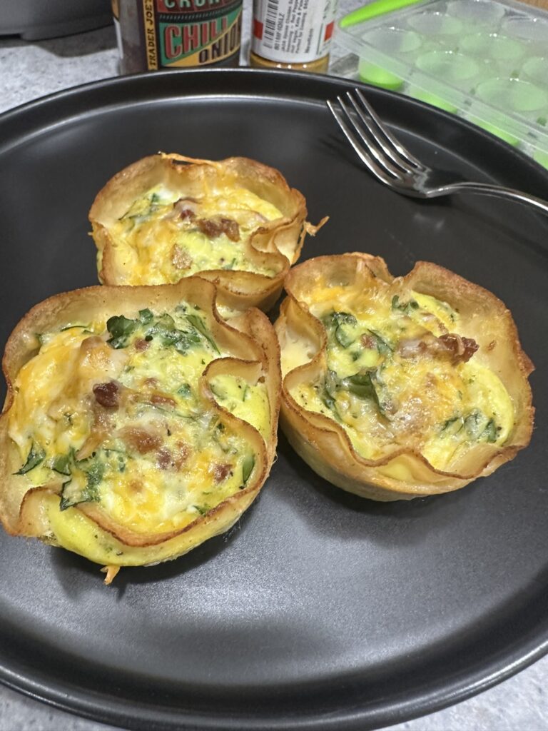 Image of cooked scrambled egg sitting in lunch meat.