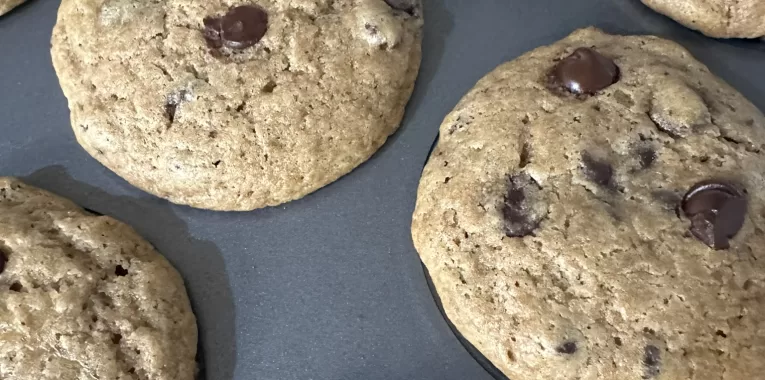 Image of chocolate chip muffins in muffin tin.