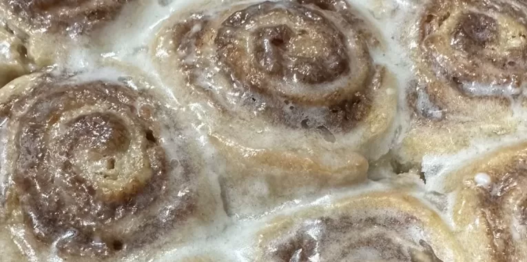 Image of cinnamon sweet rolls in a casserole dish.